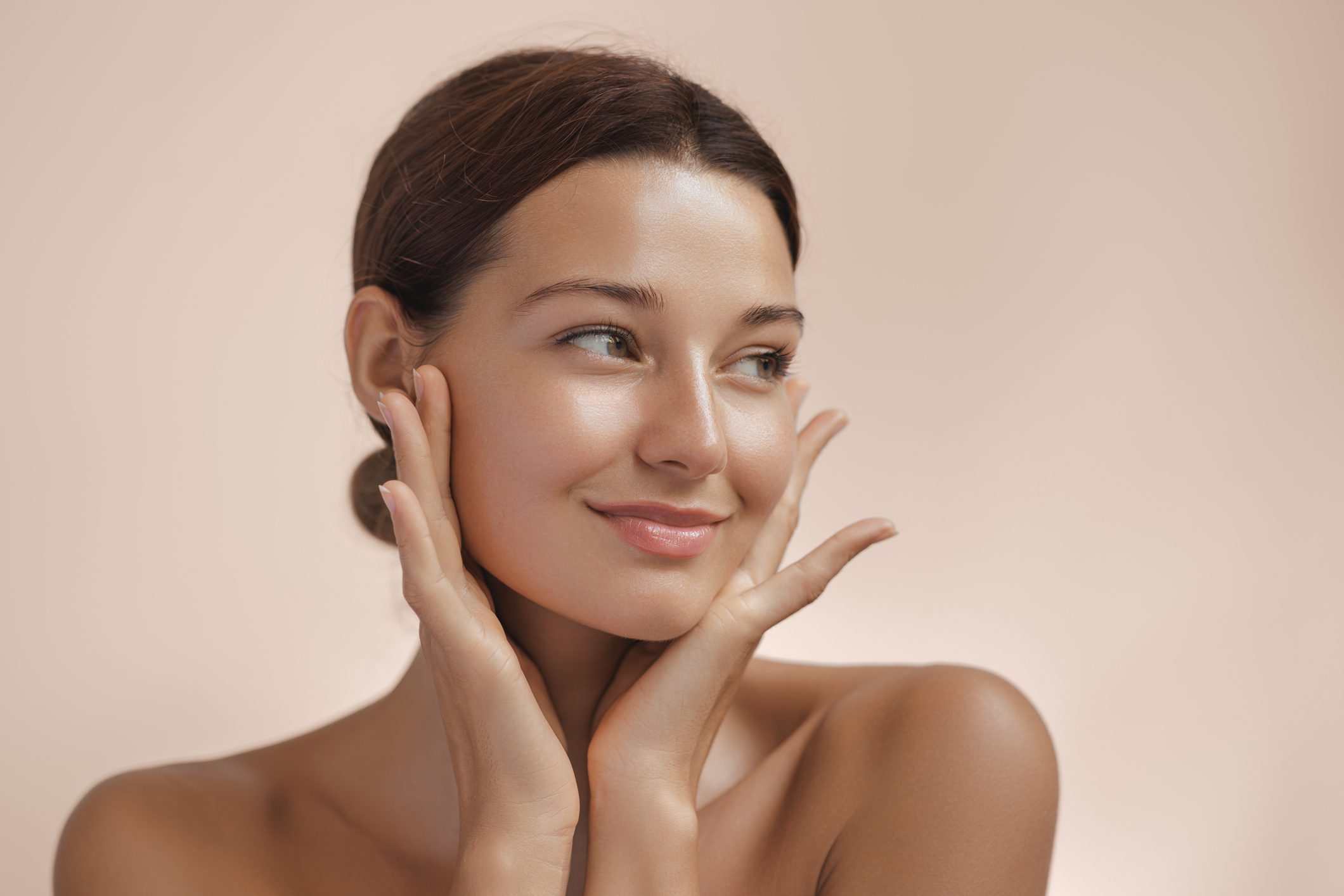 Woman with serene expression and glowing skin