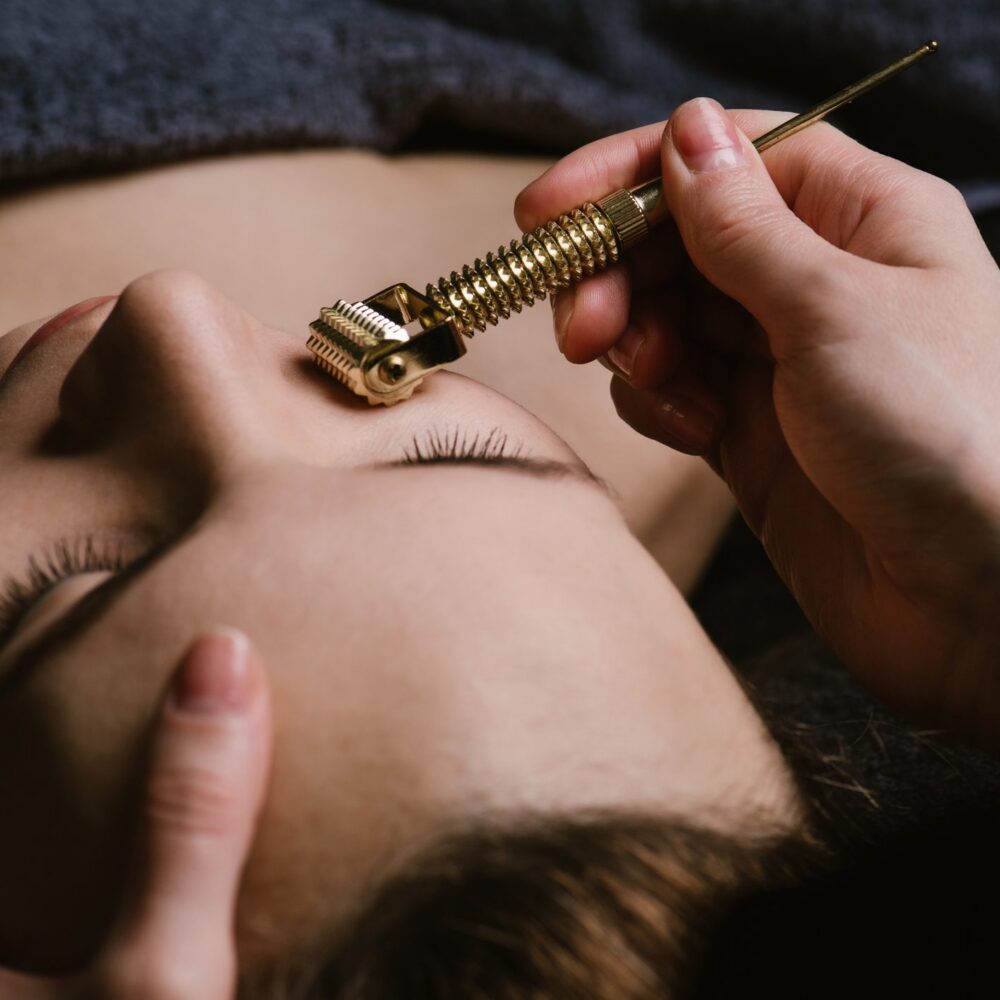 Woman receiving facial therapy