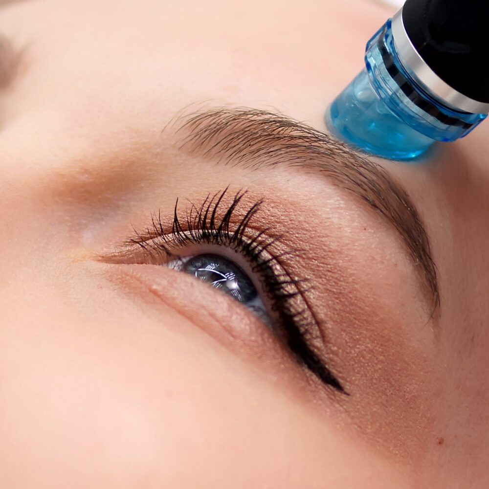 Woman receiving facial beauty treatment