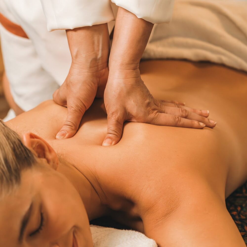 Therapist giving soothing massage therapy