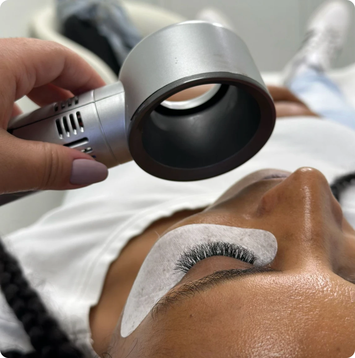 Woman receiving eyelash treatment